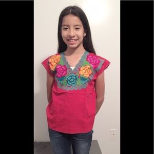 Embroidered pink blouse